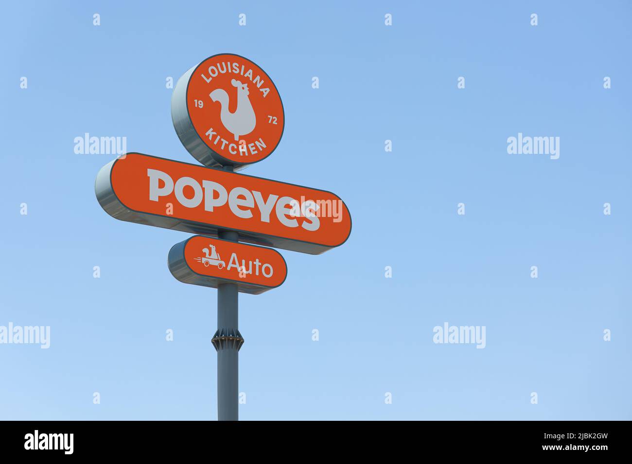 ALFAFAR, SPAIN - JUNE 06, 2022: Popeyes is an American multinational chain of fried chicken fast food restaurants Stock Photo
