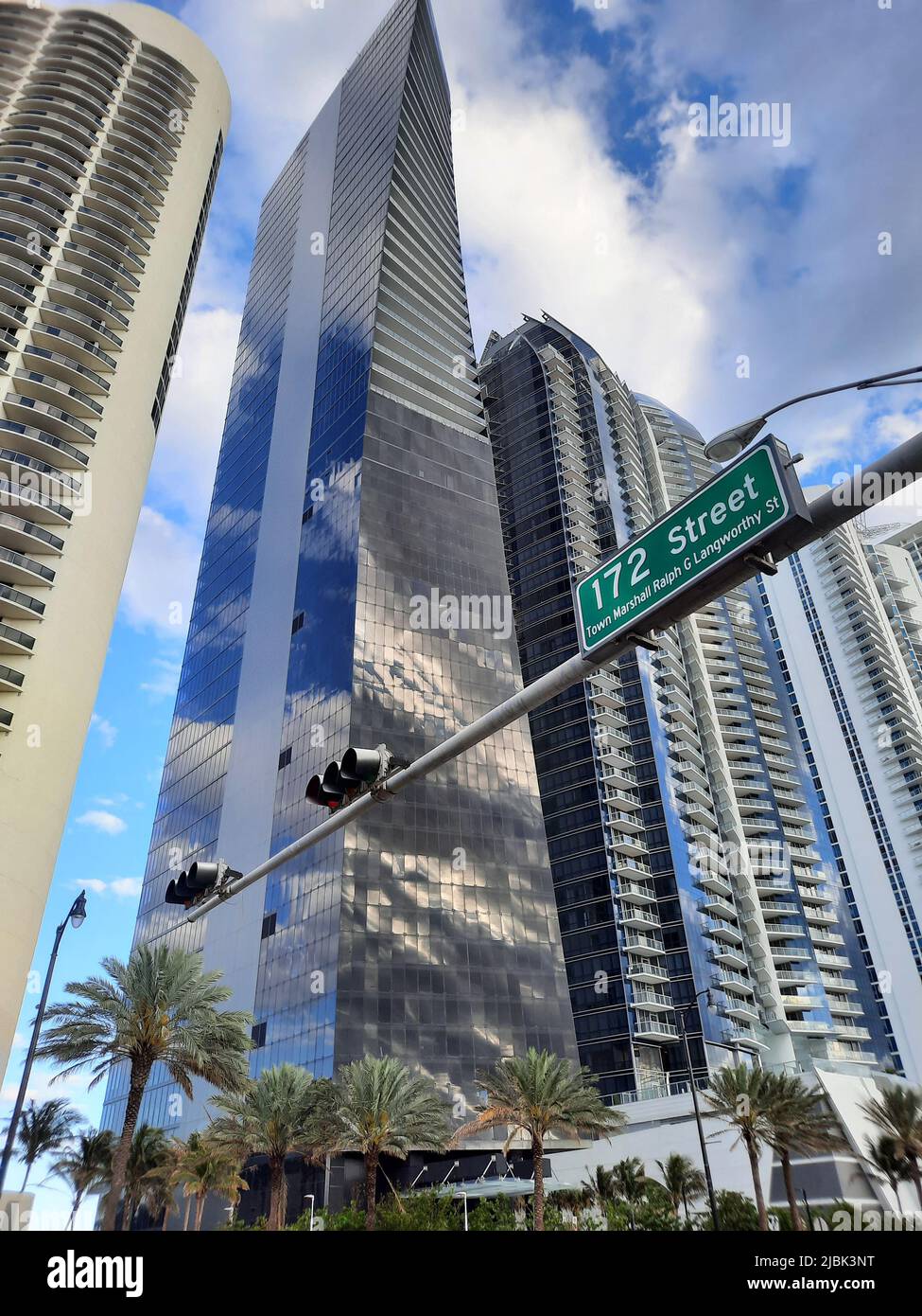 High-risers on cloudy sky in city street of Sunny Isles, USA Stock Photo