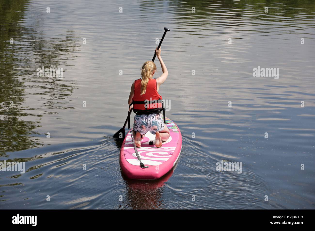 Stand up paddle surfing and stand up paddle boarding sup hires stock