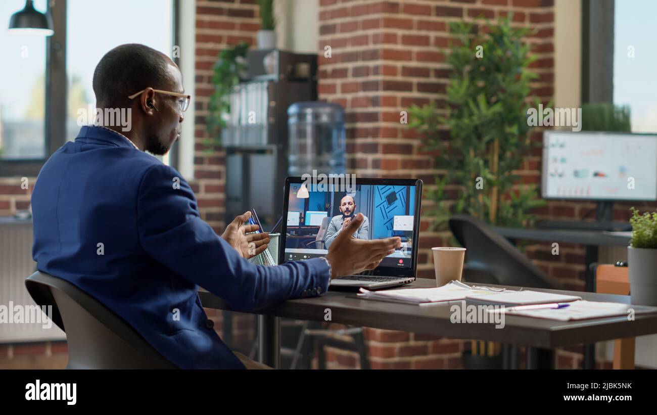 Financial analyst using online teleconference hi-res stock photography ...
