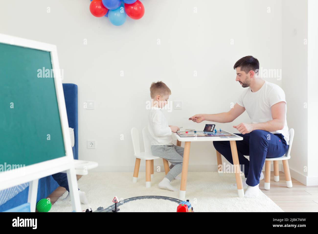 Two boys play board game hi-res stock photography and images - Alamy