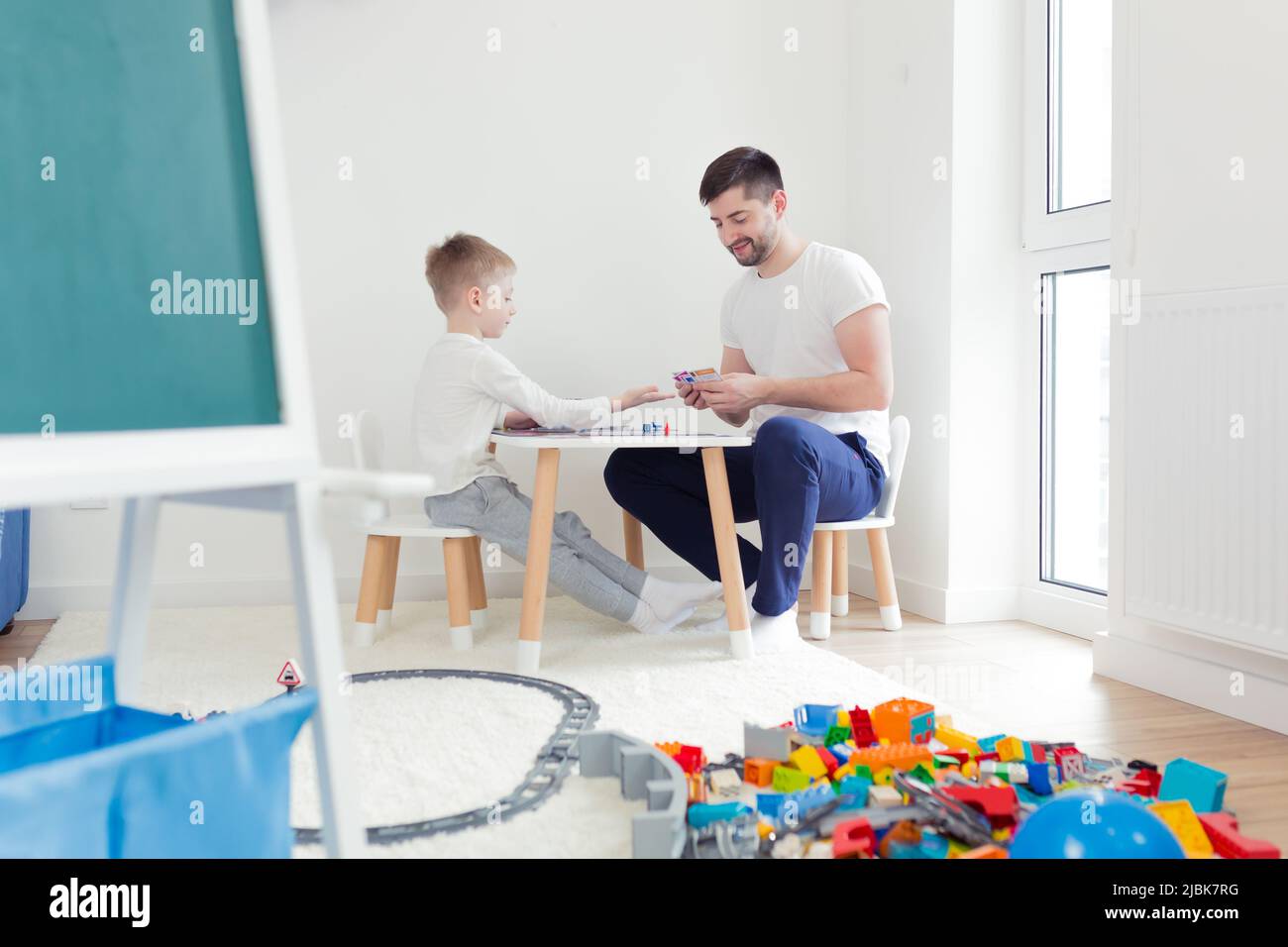 Two boys play board game hi-res stock photography and images - Alamy