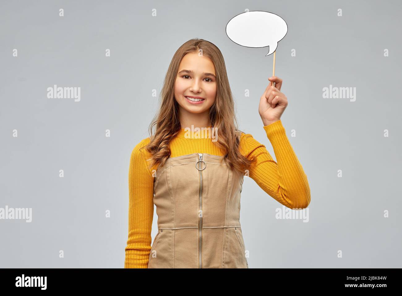 teenage girl holding speech bubble Stock Photo