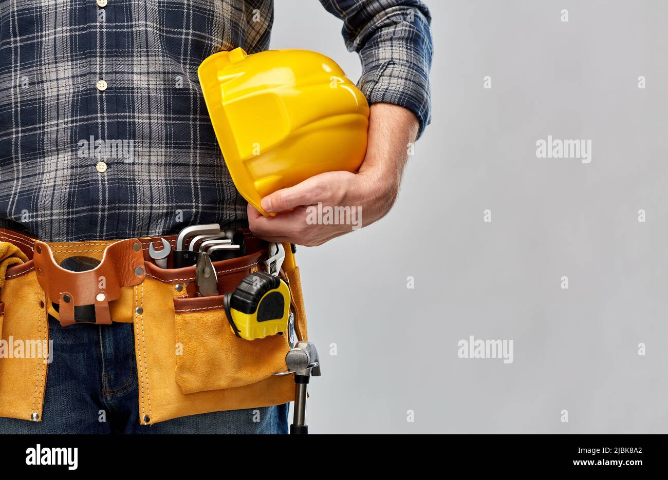 worker or builder with helmet and working tools Stock Photo