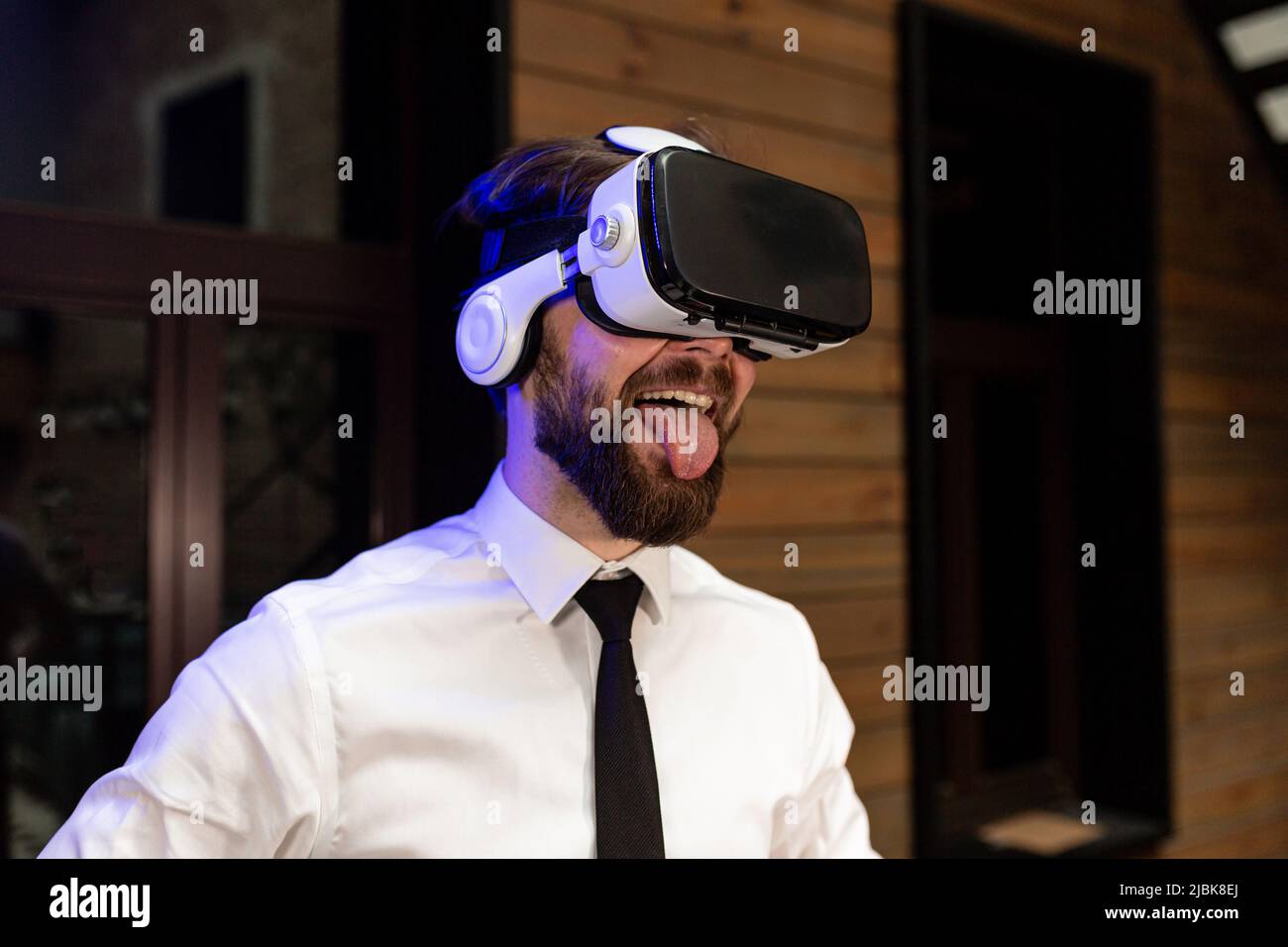 A man office manager in formal clothing wearing virtual reality vr ...