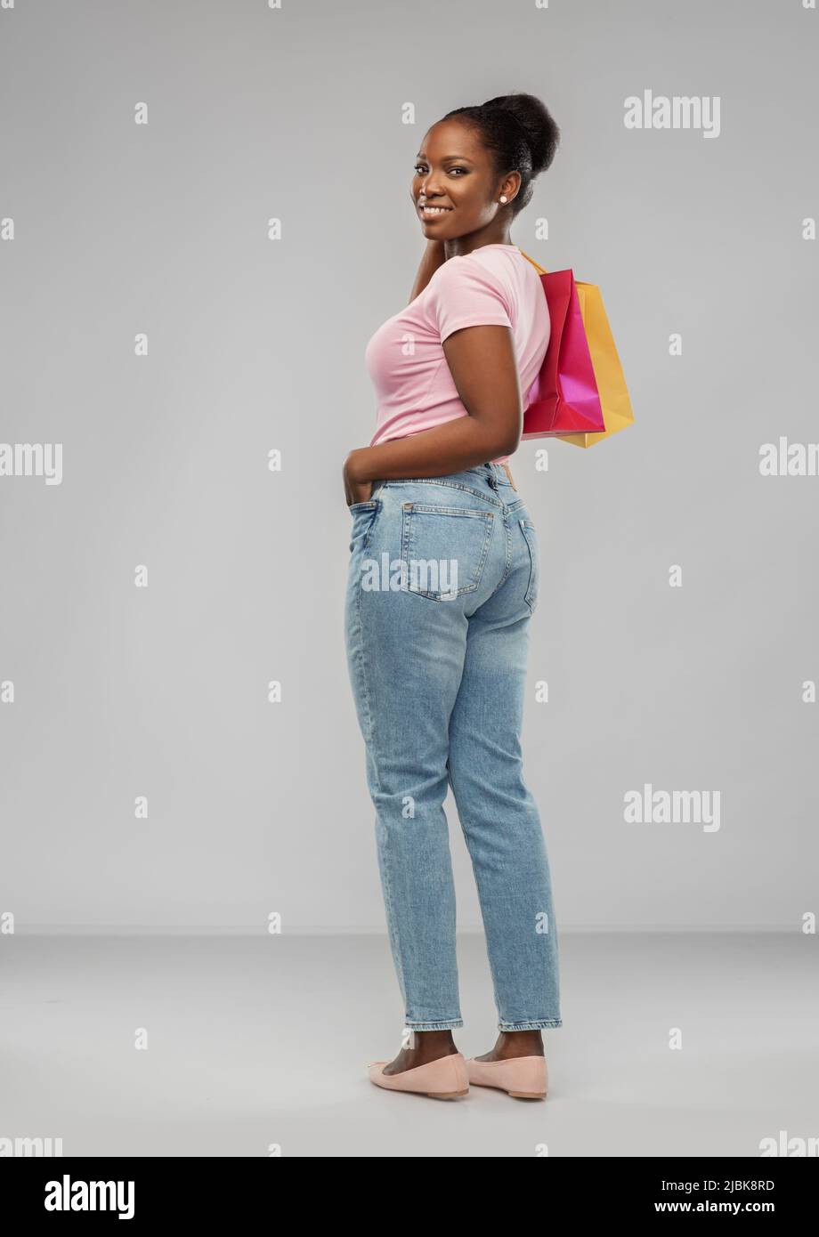 happy african american woman with shopping bags Stock Photo