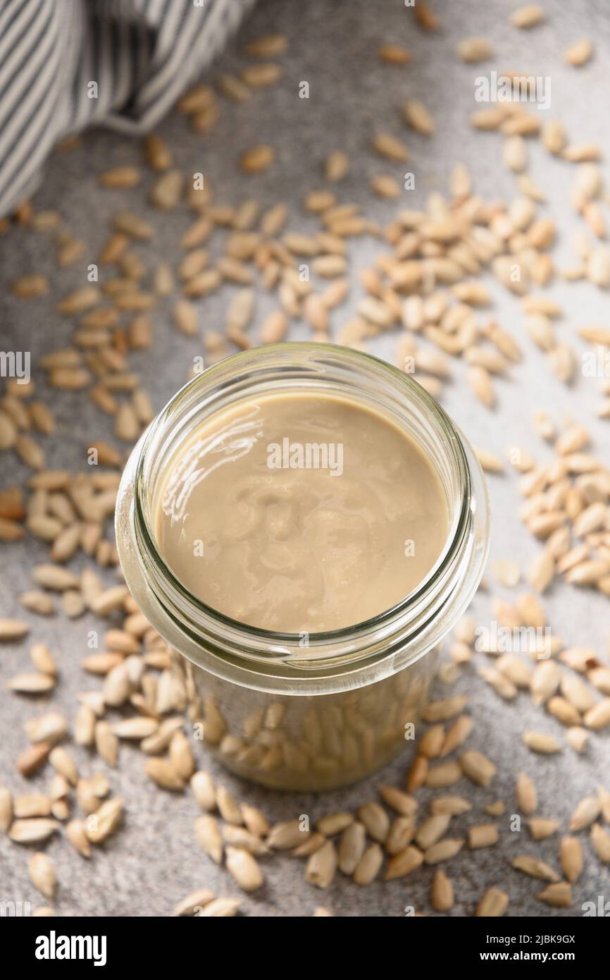 Sunflower seeds butter in glass jar. Nut free vegan allergyfriendly