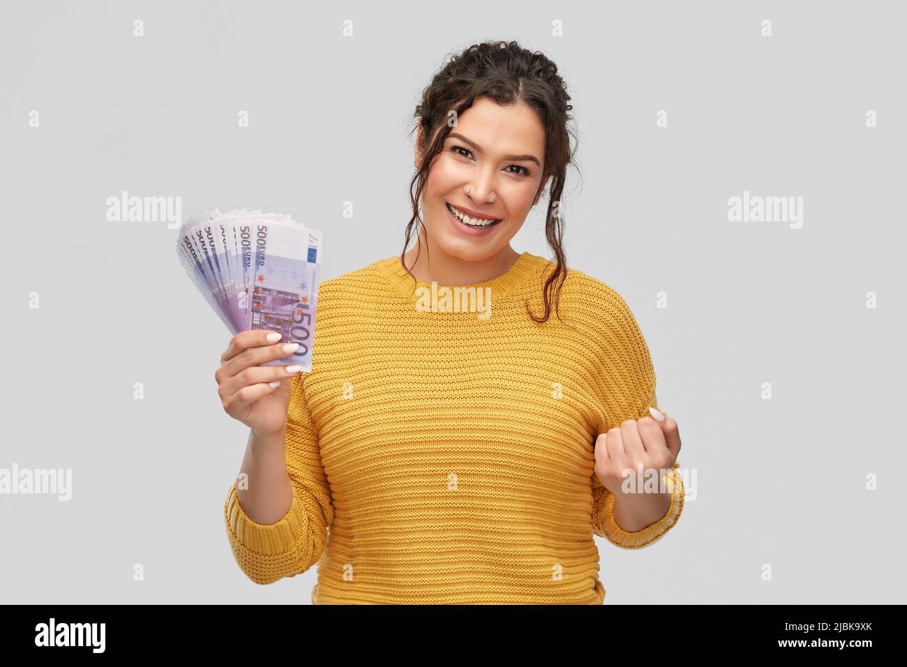 Woman smiling fist pump hi-res stock photography and images - Alamy