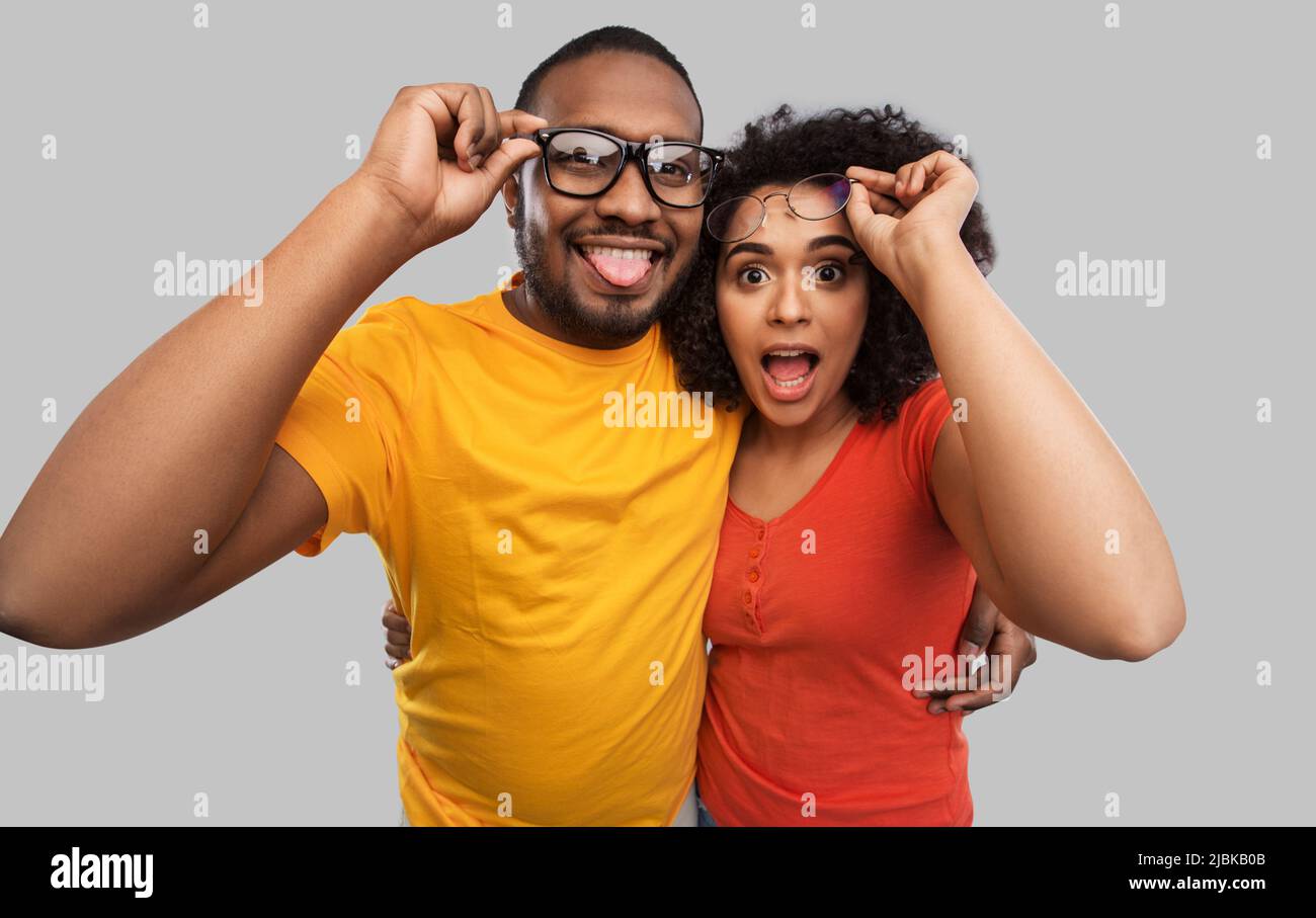 happy african american couple in glasses hugging Stock Photo - Alamy