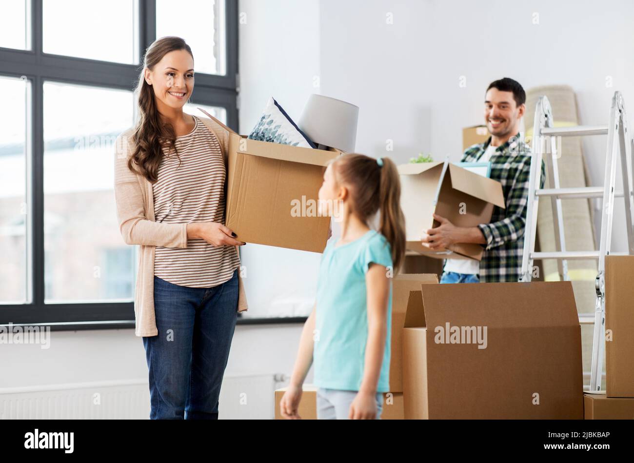 happy family with child moving to new home Stock Photo