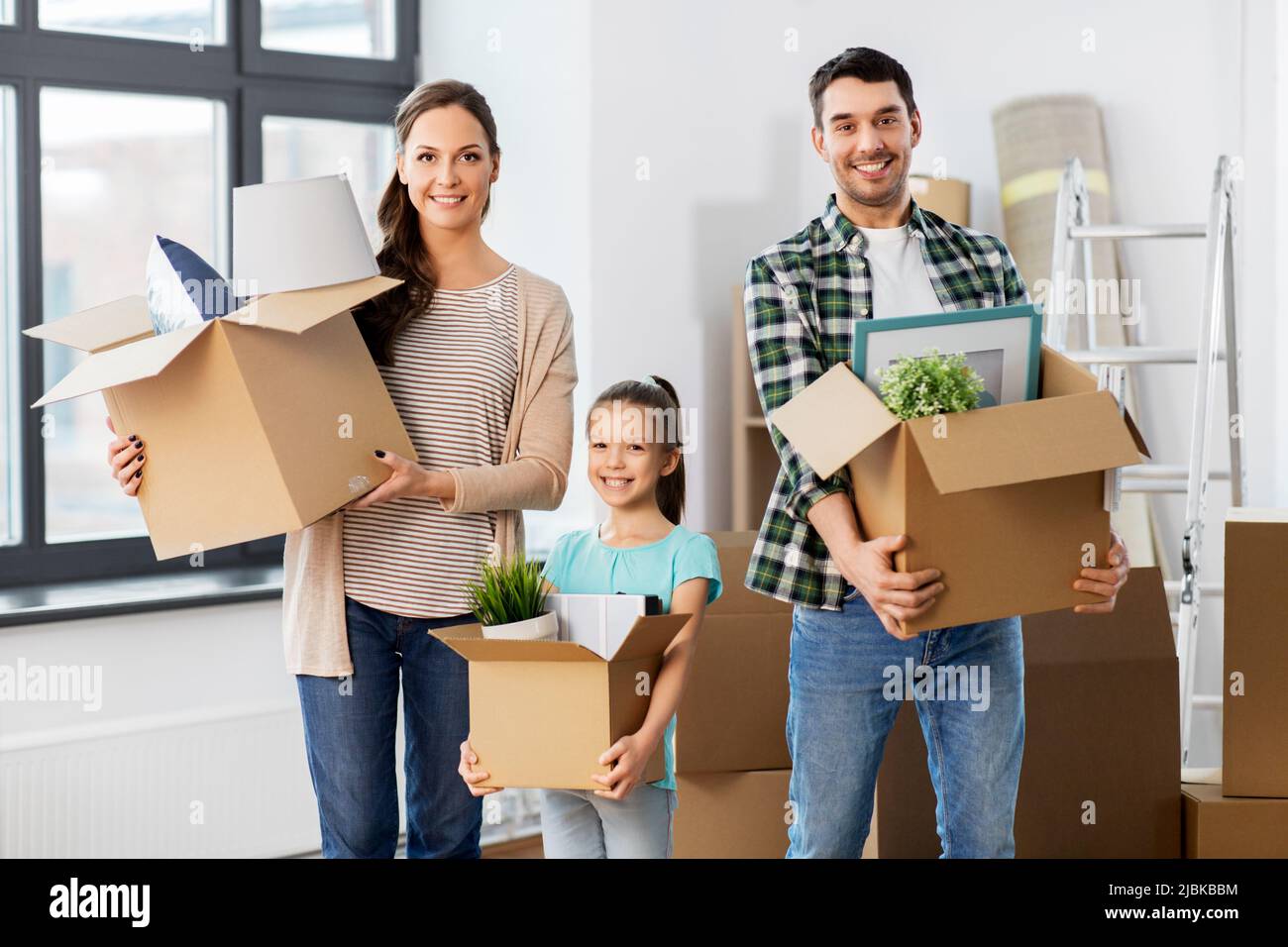 happy family with child moving to new home Stock Photo - Alamy
