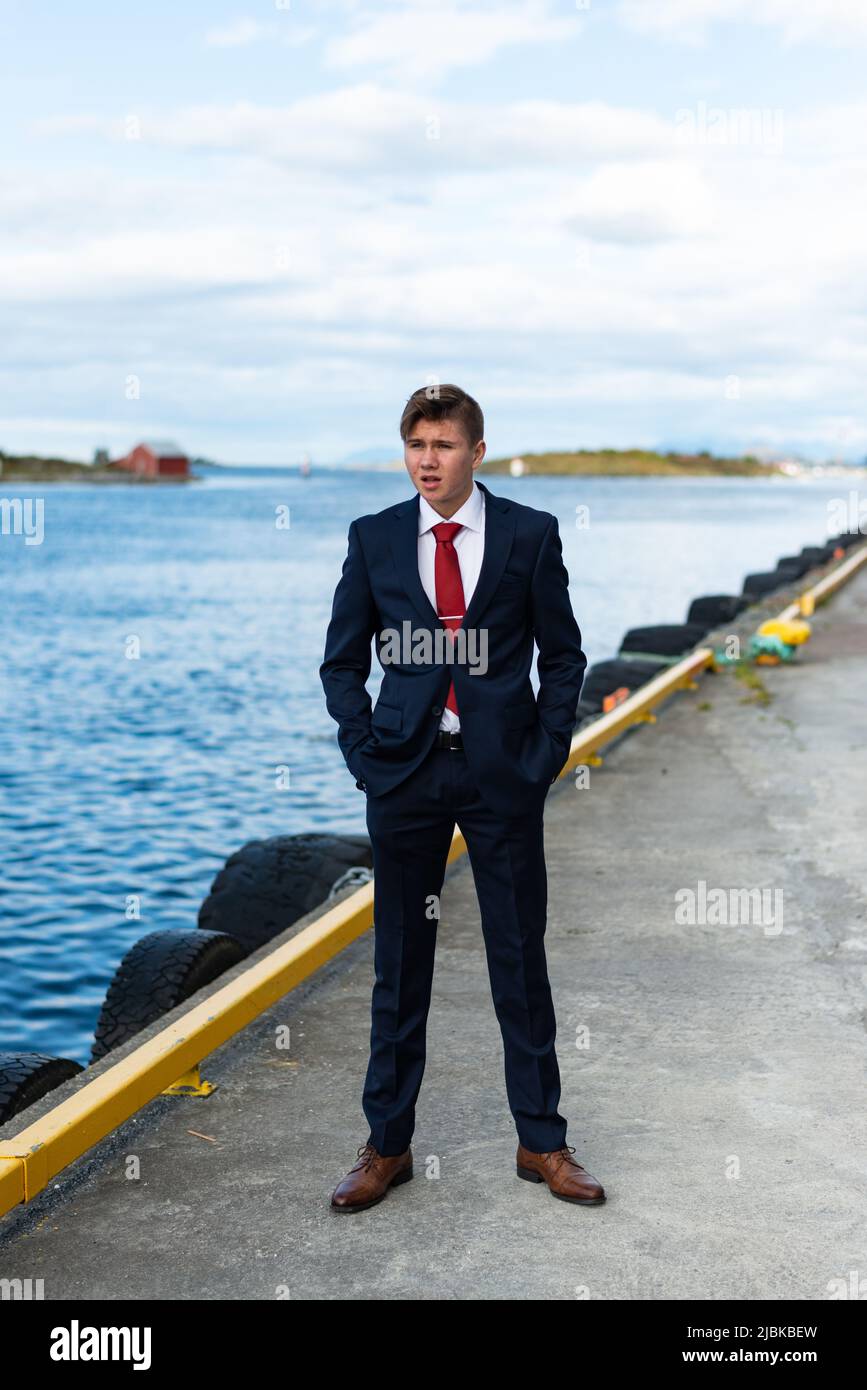 A dressed up young man looking bored and self assured. Stock Photo