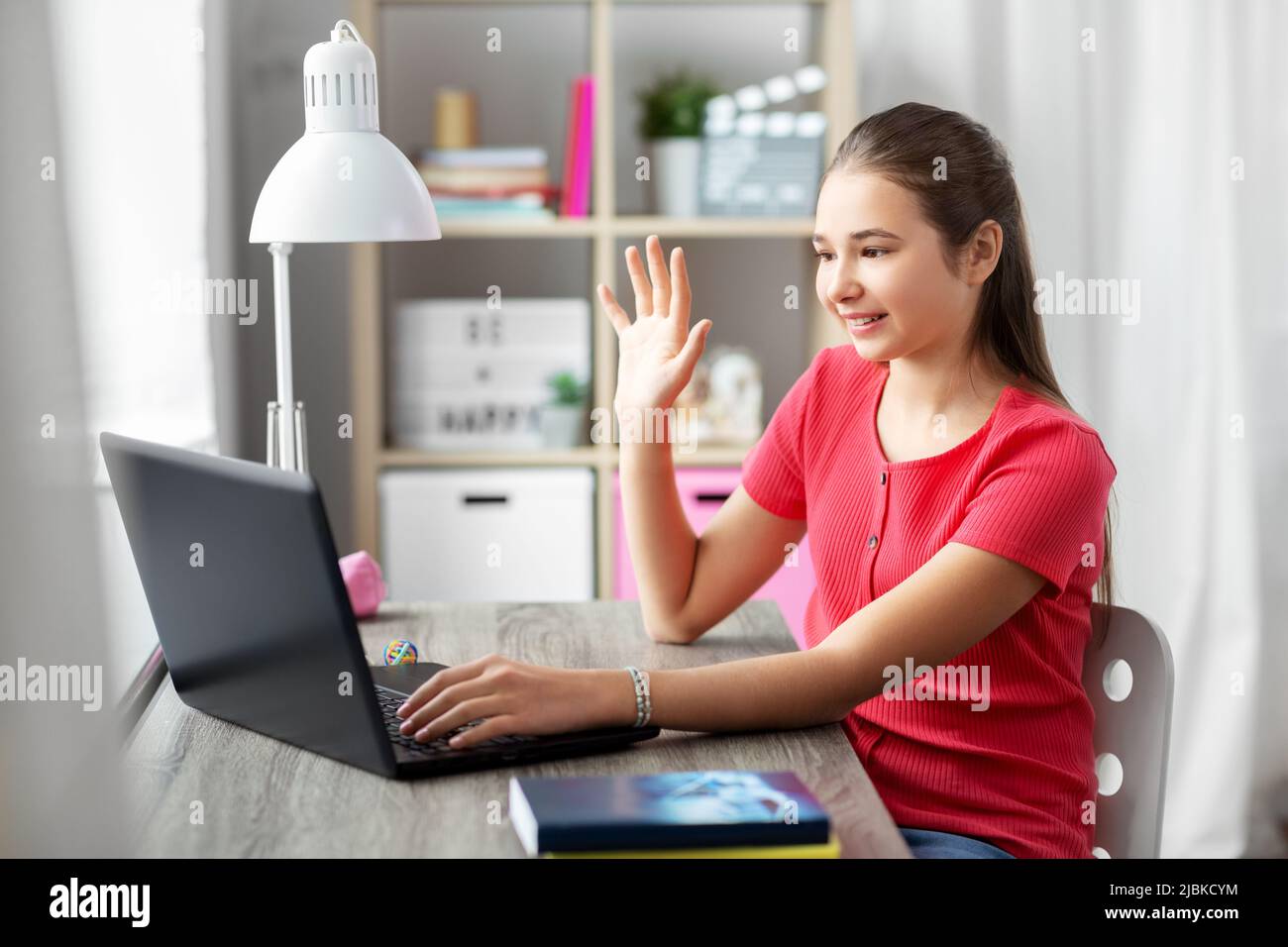 student girl with laptop having video call at home Stock Photo - Alamy