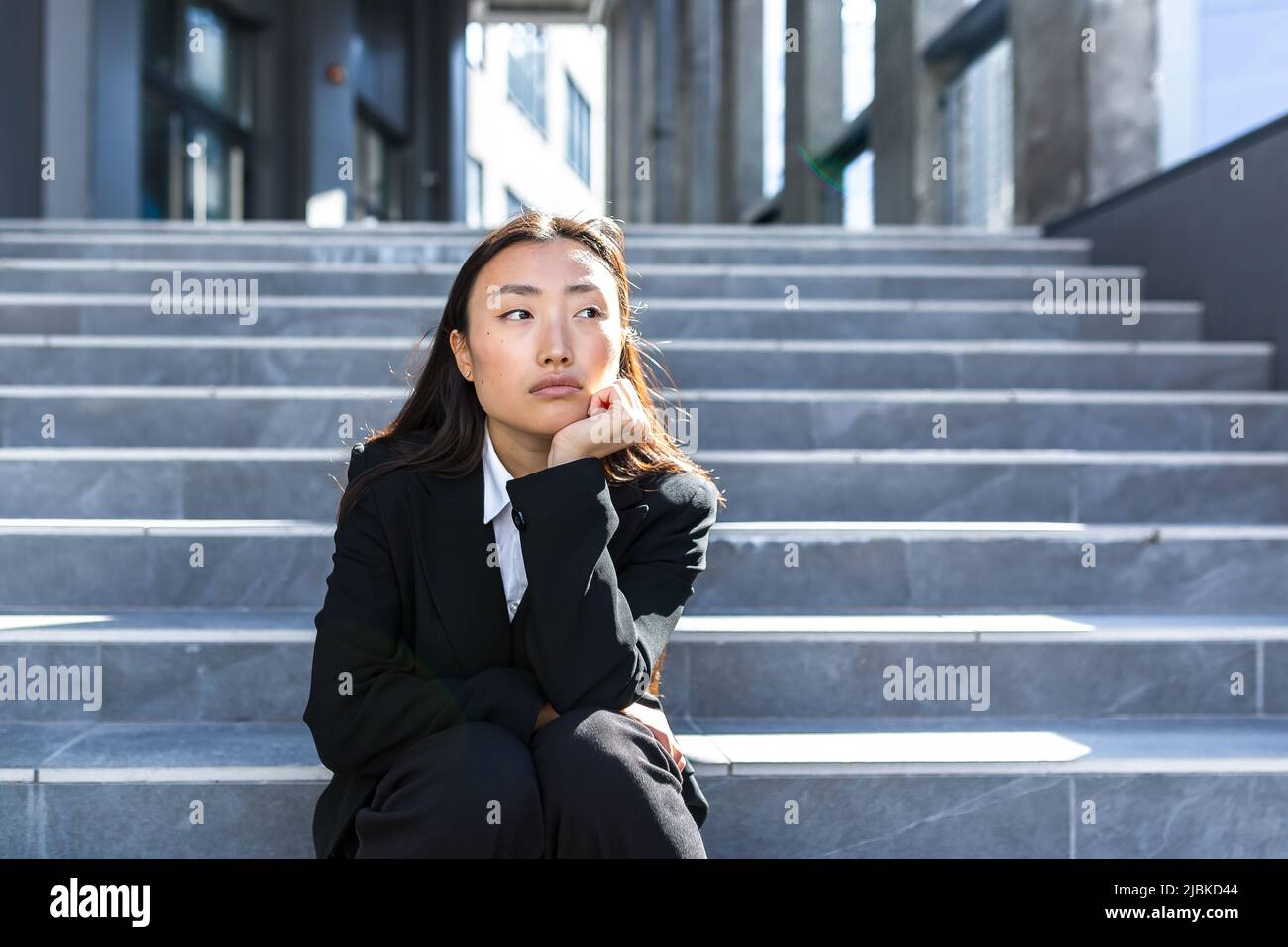 Sad asian woman outside hi-res stock photography and images - Alamy