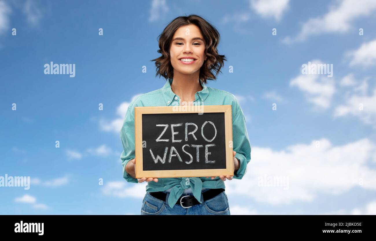 happy woman with chalkboard with zero waste words Stock Photo