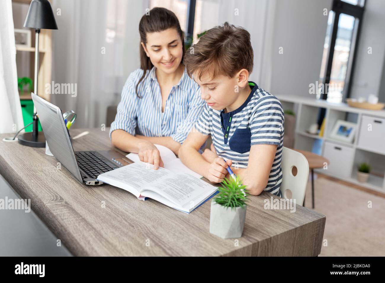 mother and son doing homework together Stock Photo - Alamy