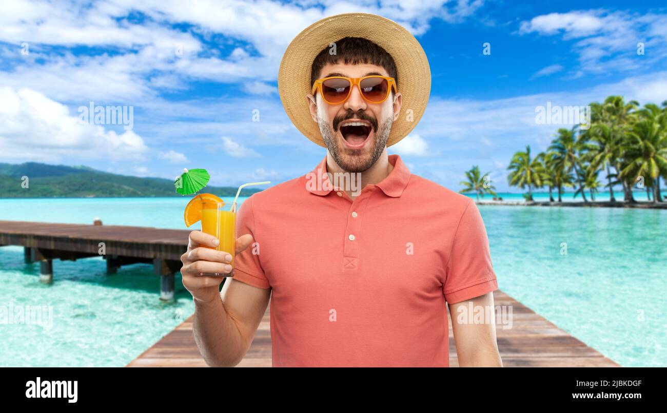 https://c8.alamy.com/comp/2JBKDGF/happy-man-in-straw-hat-with-juice-on-beach-2JBKDGF.jpg