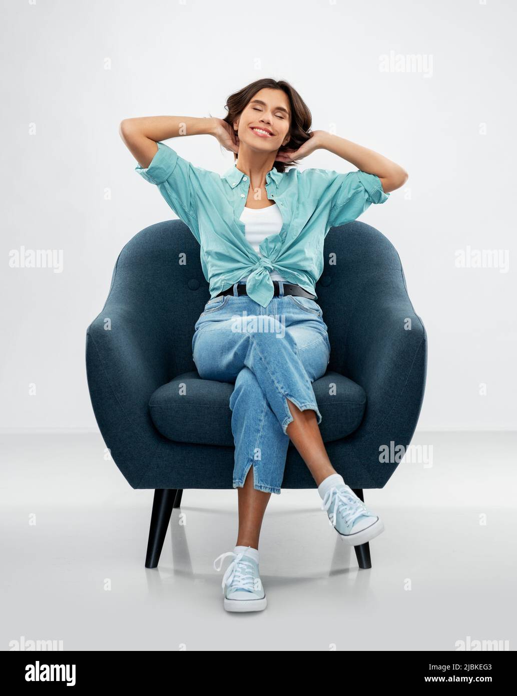 Woman sitting chair eyes closed hi-res stock photography and images - Alamy