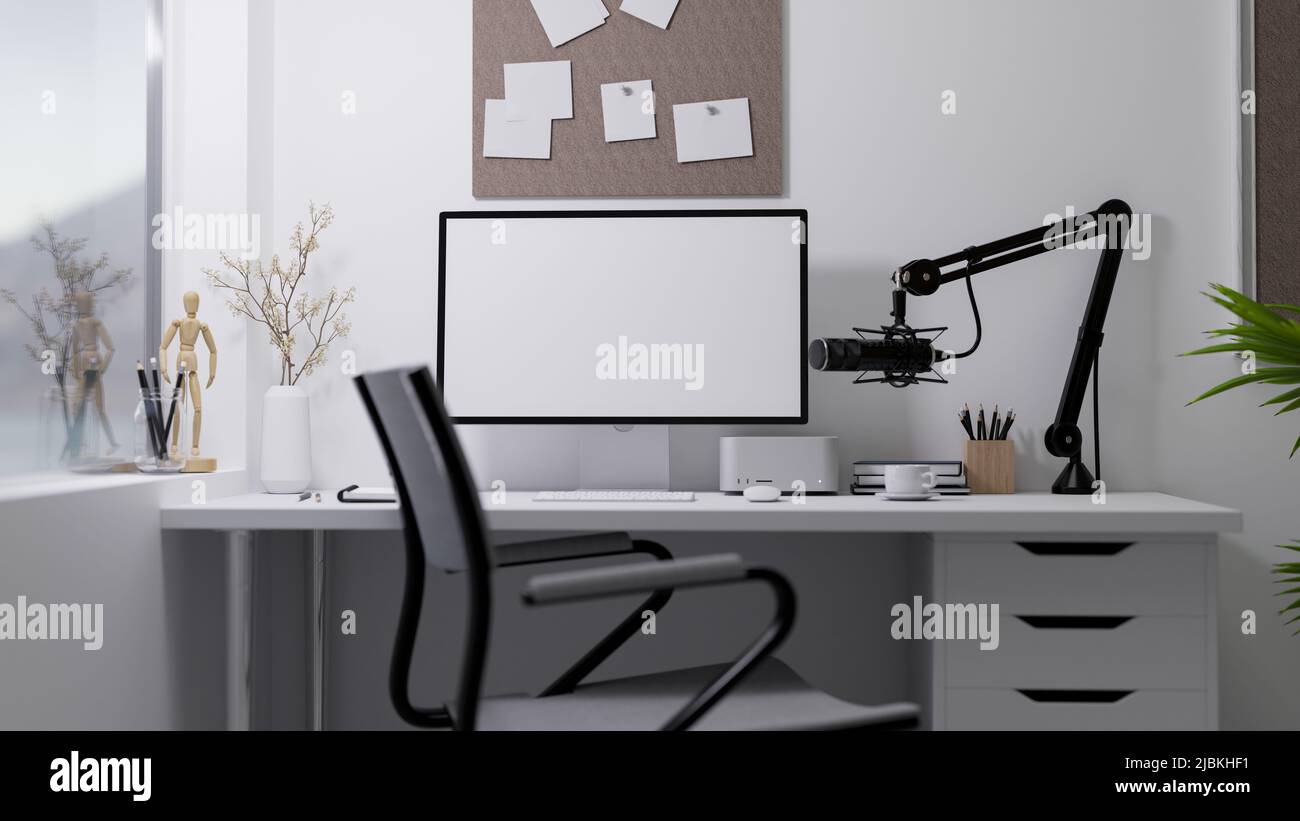 Broadcasting or live-streaming home office studio interior with modern pc computer, microphone and accessories o white table over white wall. 3d rende Stock Photo