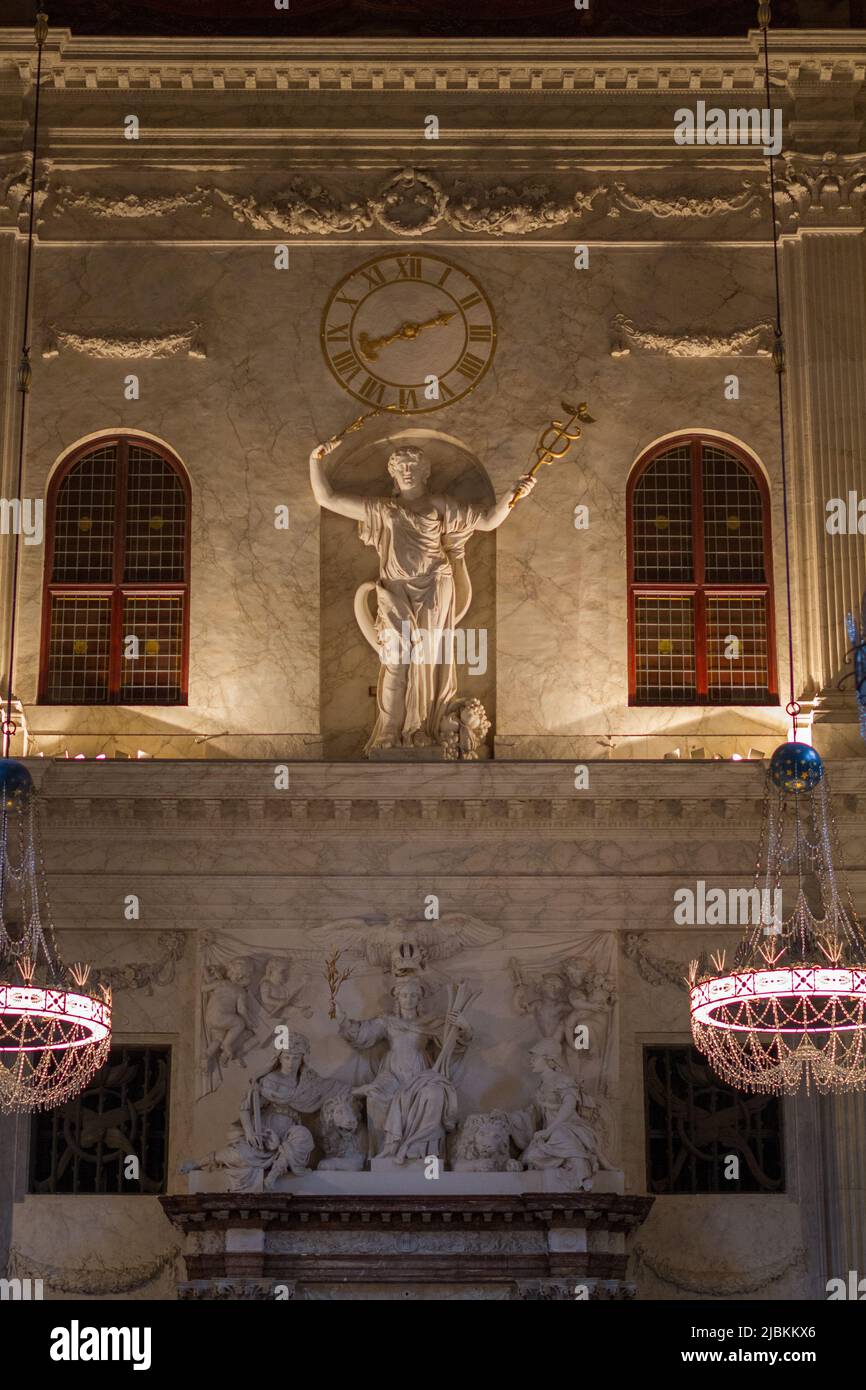 Clock statue inside Royal Palace of Amsterdam in Dam Square Stock Photo