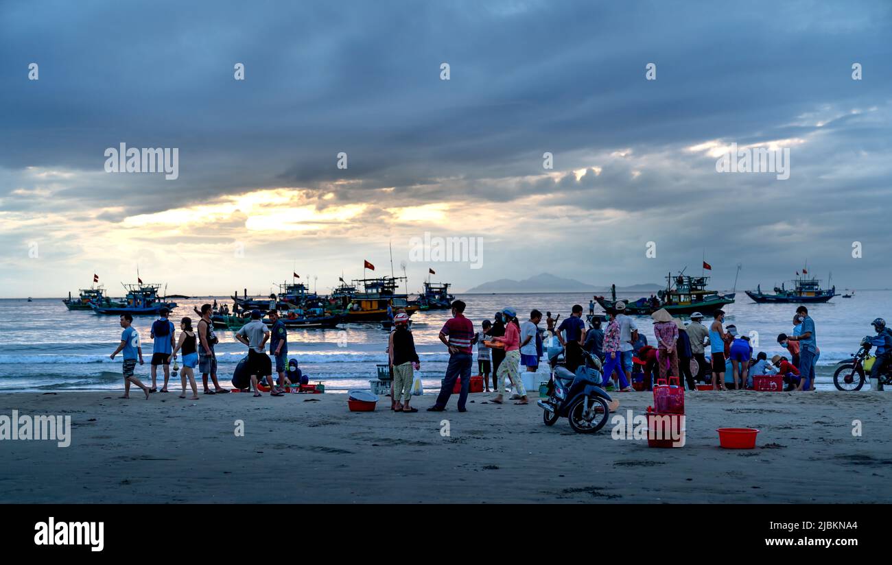 My Khe Beach, Da Nang City, Vietnam - April 30, 2022: Fish market at dawn when people are busy sorting, buying and selling fresh and lively fish Stock Photo