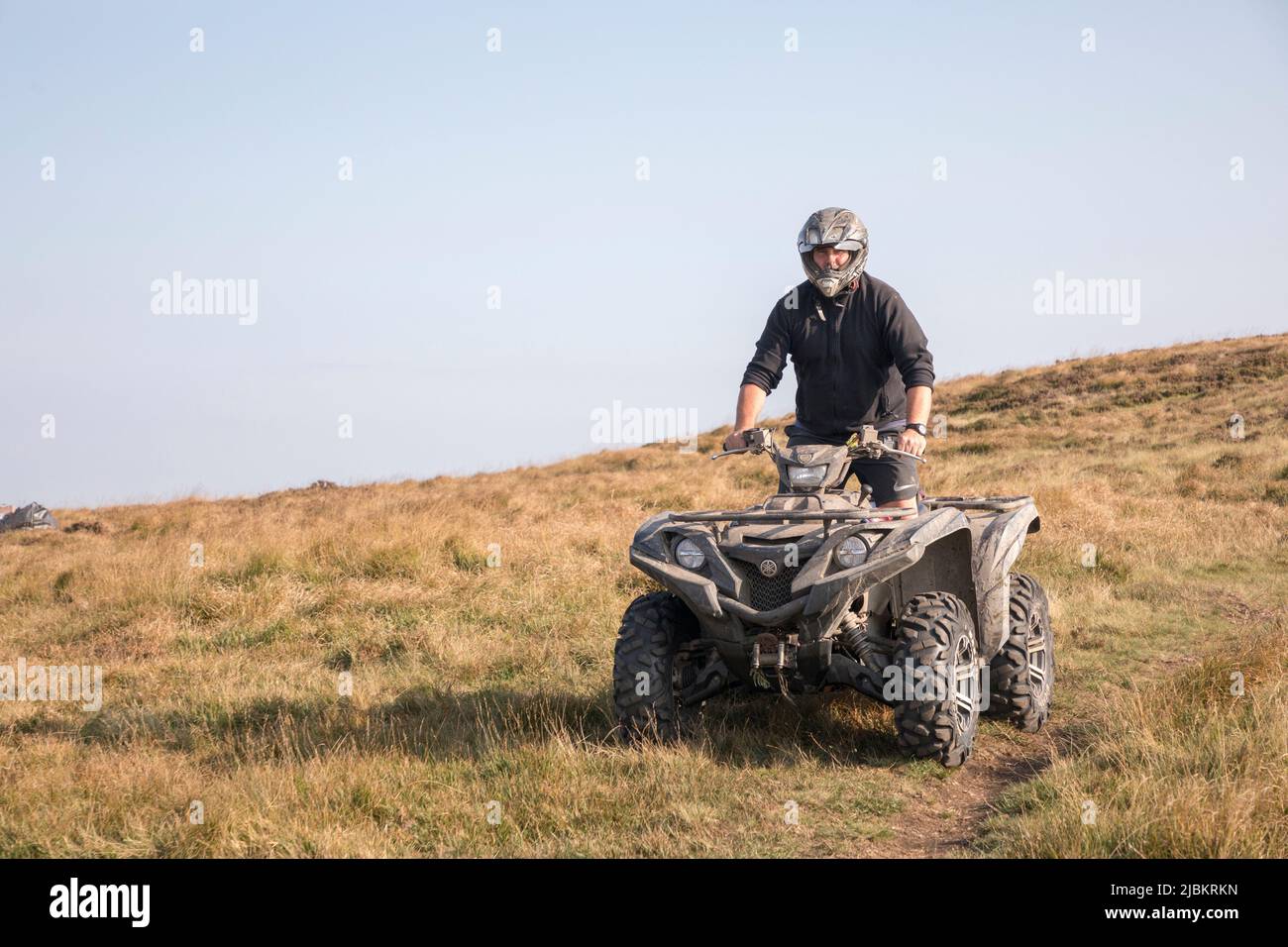 Off road quad bike used off road on moorland in the Black Mountains at the head of the Grwyne Fawr, Wales, UK Stock Photo