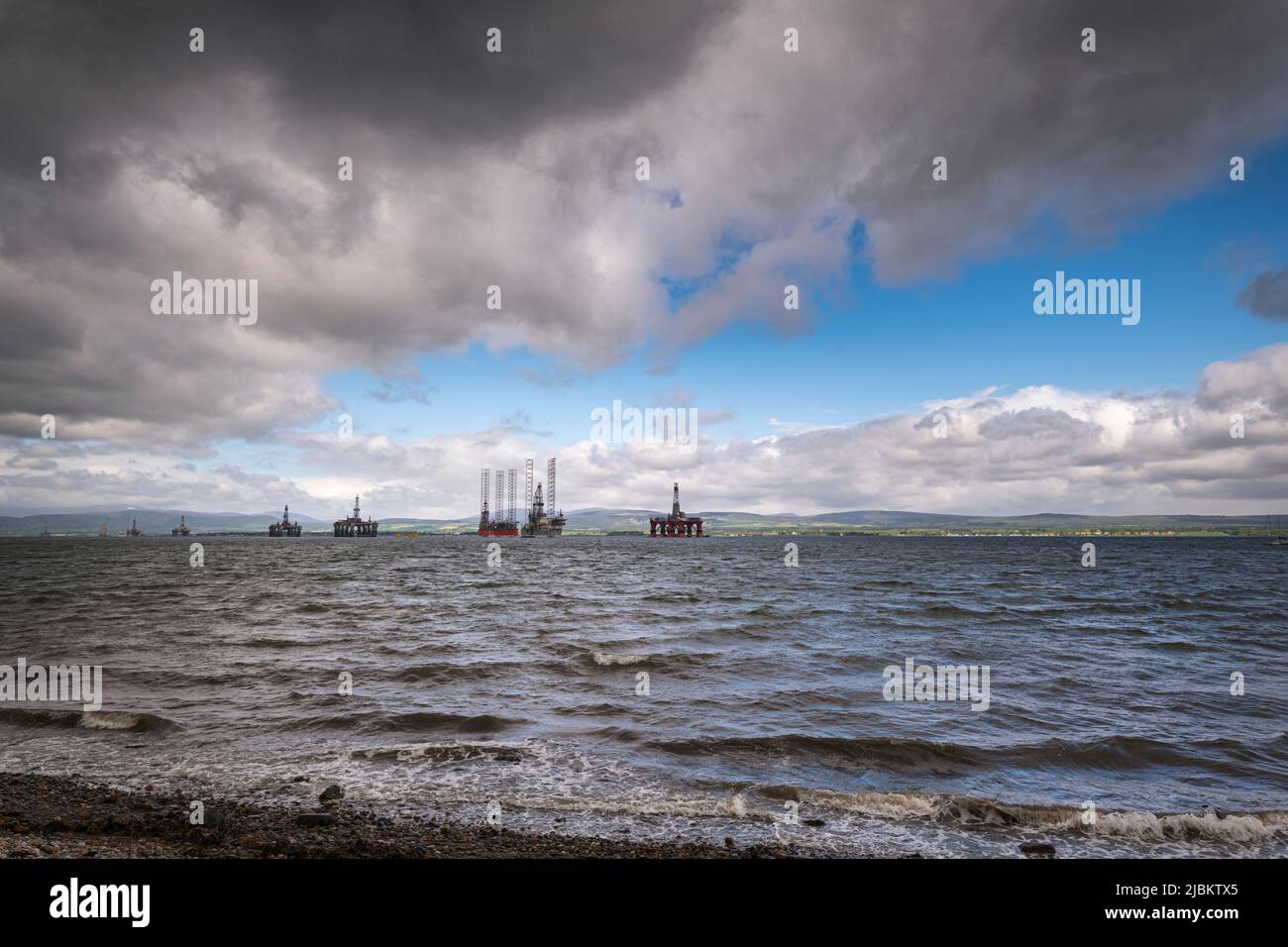 A cloudy, summer HDR image of the Oil rig graveyard in the Cromarty Firth near Invergordon, Scotland. 27 May 2022 Stock Photo