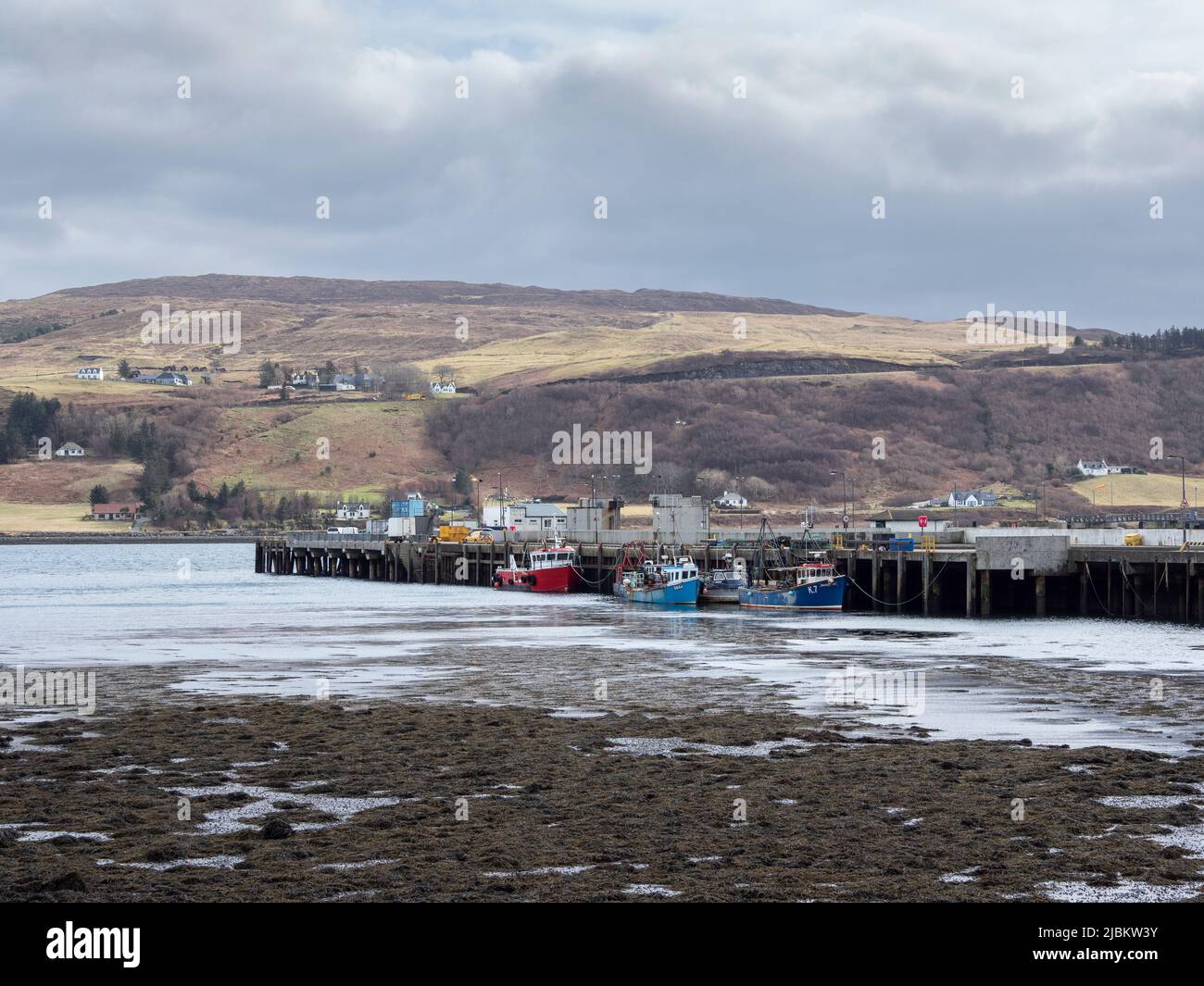 Fishing boats moored at Uig pier on the Isle of Skye, Scotland Stock Photo