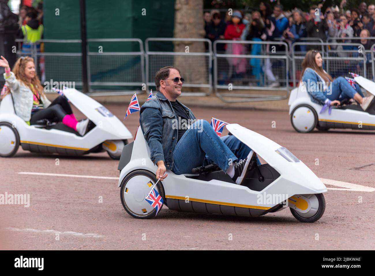 Sinclair C5 cars at the Queen's Platinum Jubilee Pageant parade in The Mall, London, UK. Stock Photo
