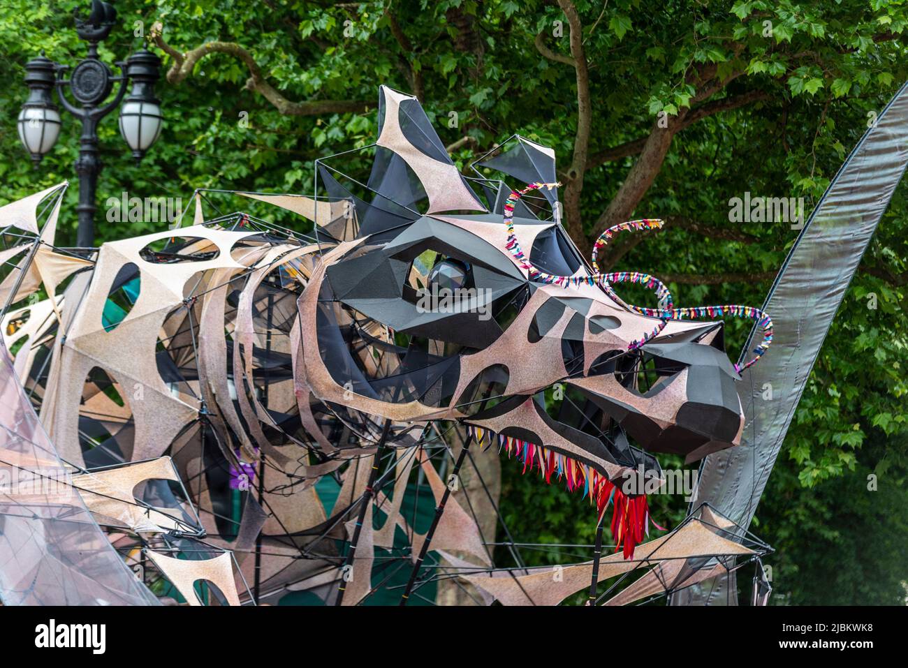 Large mechanical dragon puppet named The Hatchling at the Queen's Platinum Jubilee Pageant parade in The Mall, London, UK. Stock Photo