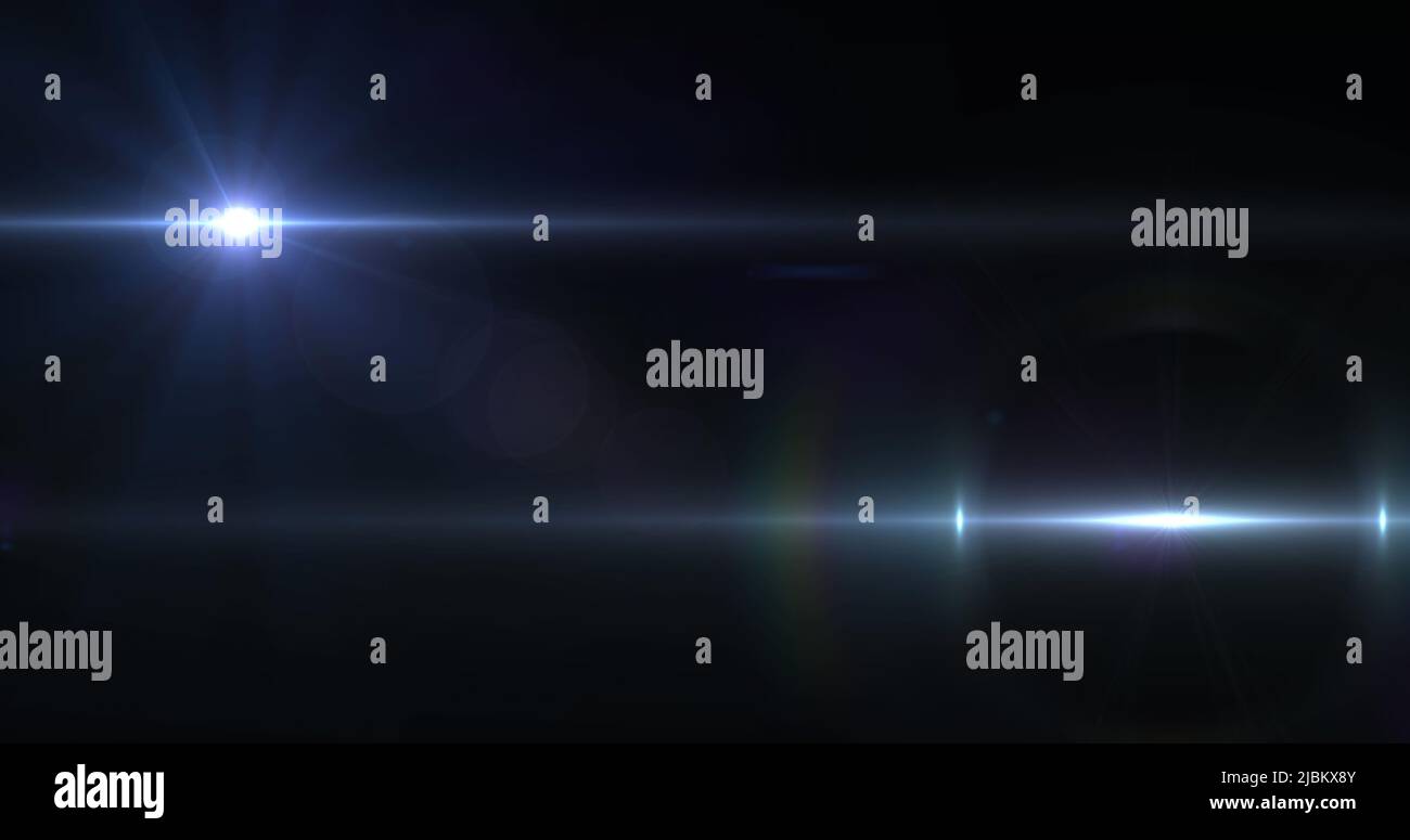 Image of two beams of white light moving across black background Stock Photo