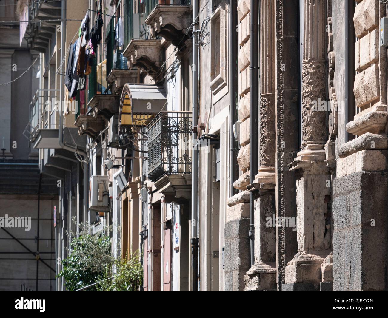 Balconies and windows on Sicilian street Stock Photo