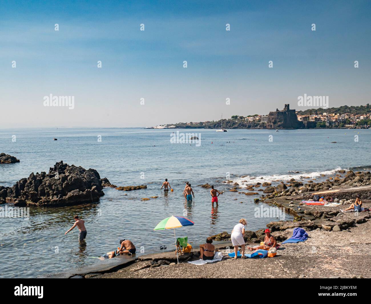 Bathers on a beach in Sicily Stock Photo
