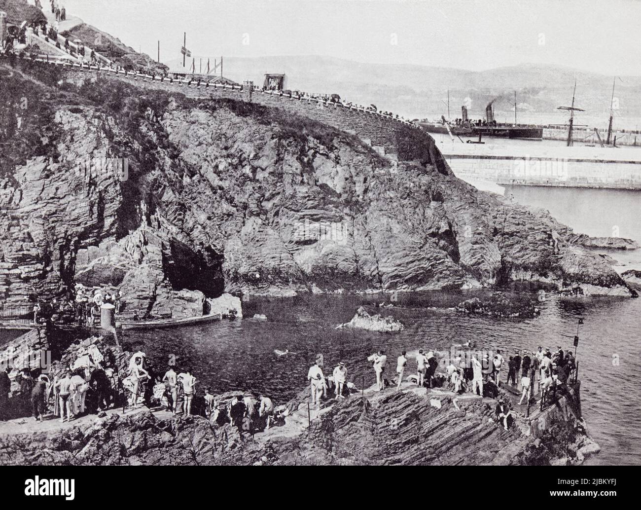 Douglas, Isle of Man. The bathing place at Port Skillion, seen here in the 19th century.  From Around The Coast,  An Album of Pictures from Photographs of the Chief Seaside Places of Interest in Great Britain and Ireland published London, 1895, by George Newnes Limited. Stock Photo