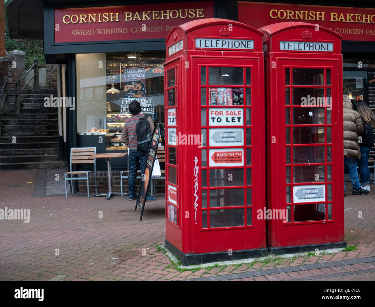 Red telephone boxes for rent as business premises Stock Photo