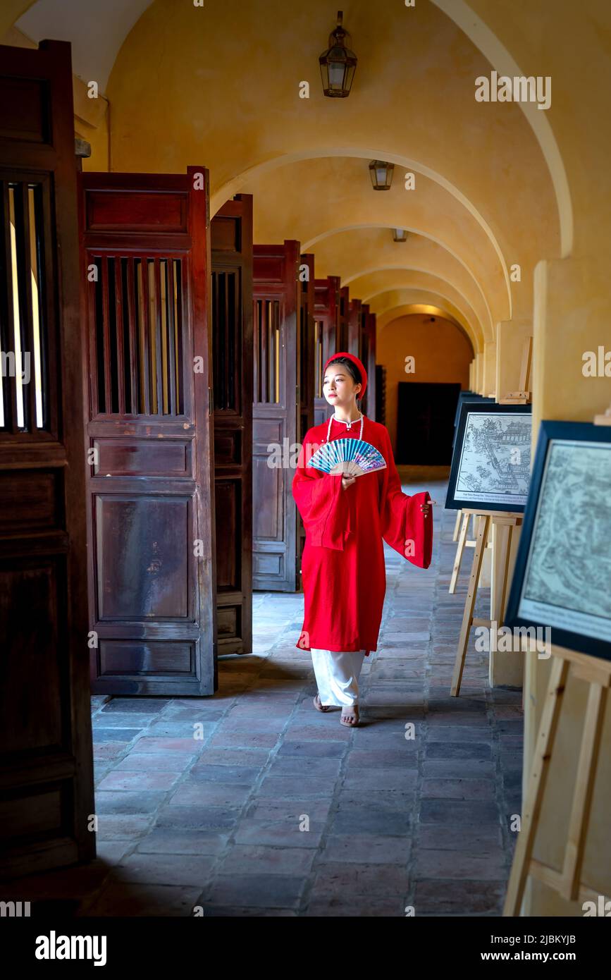 Ancient Museum, Hue City, Vietnam - April 28, 2022: Model wears a feudal five-piece long dress, known in 1744. This is the traditional costume of Viet Stock Photo