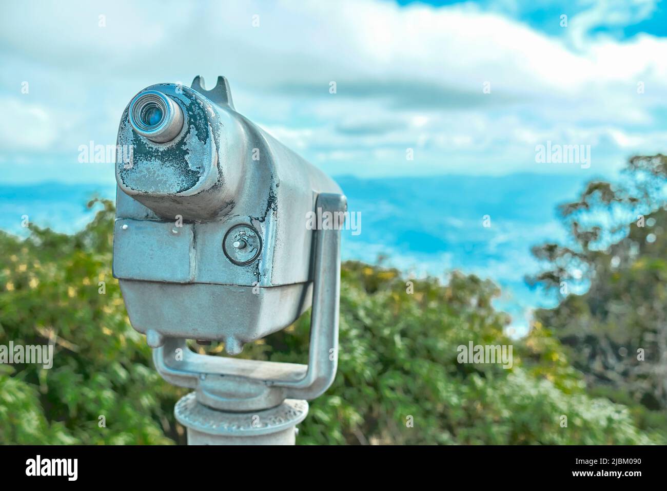 Telescope and blurred city on background. Observation point in the Avila, Caracas. Landscape concept Stock Photo