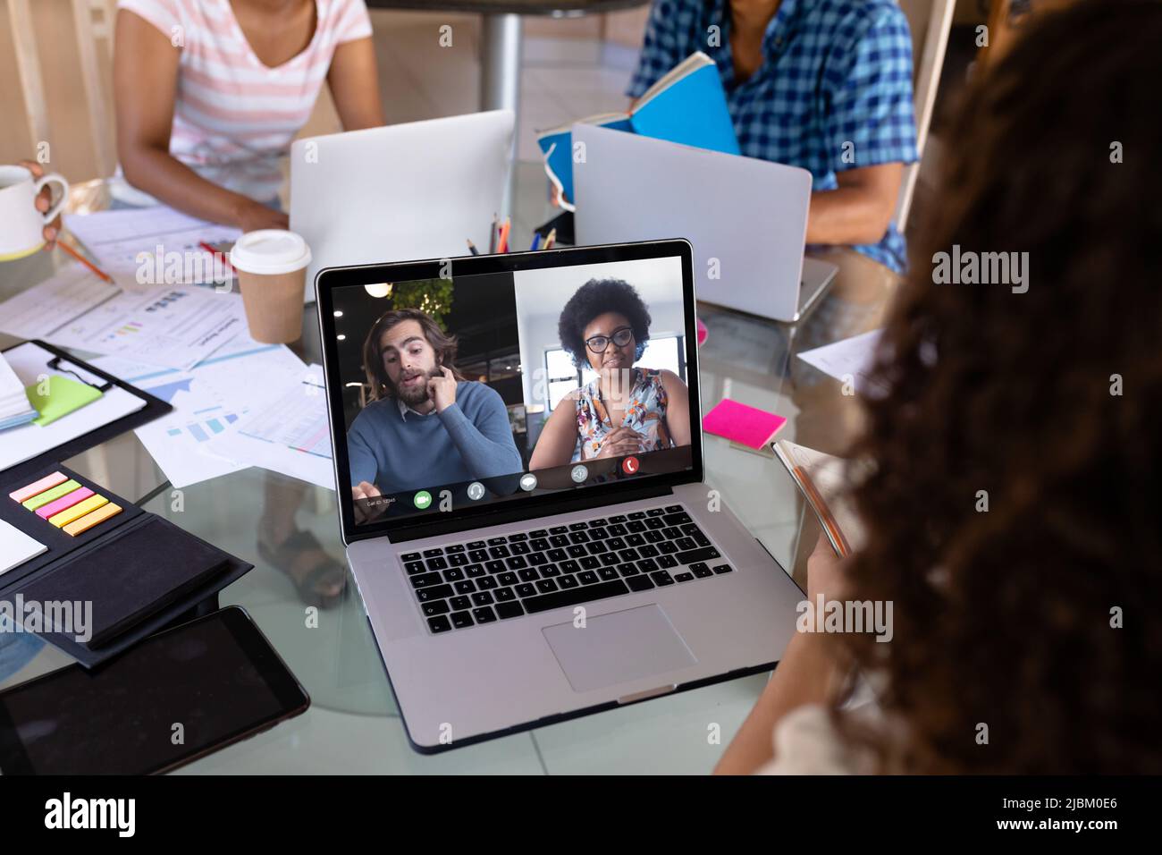 Multiracial male and female colleagues on video call during meeting ...