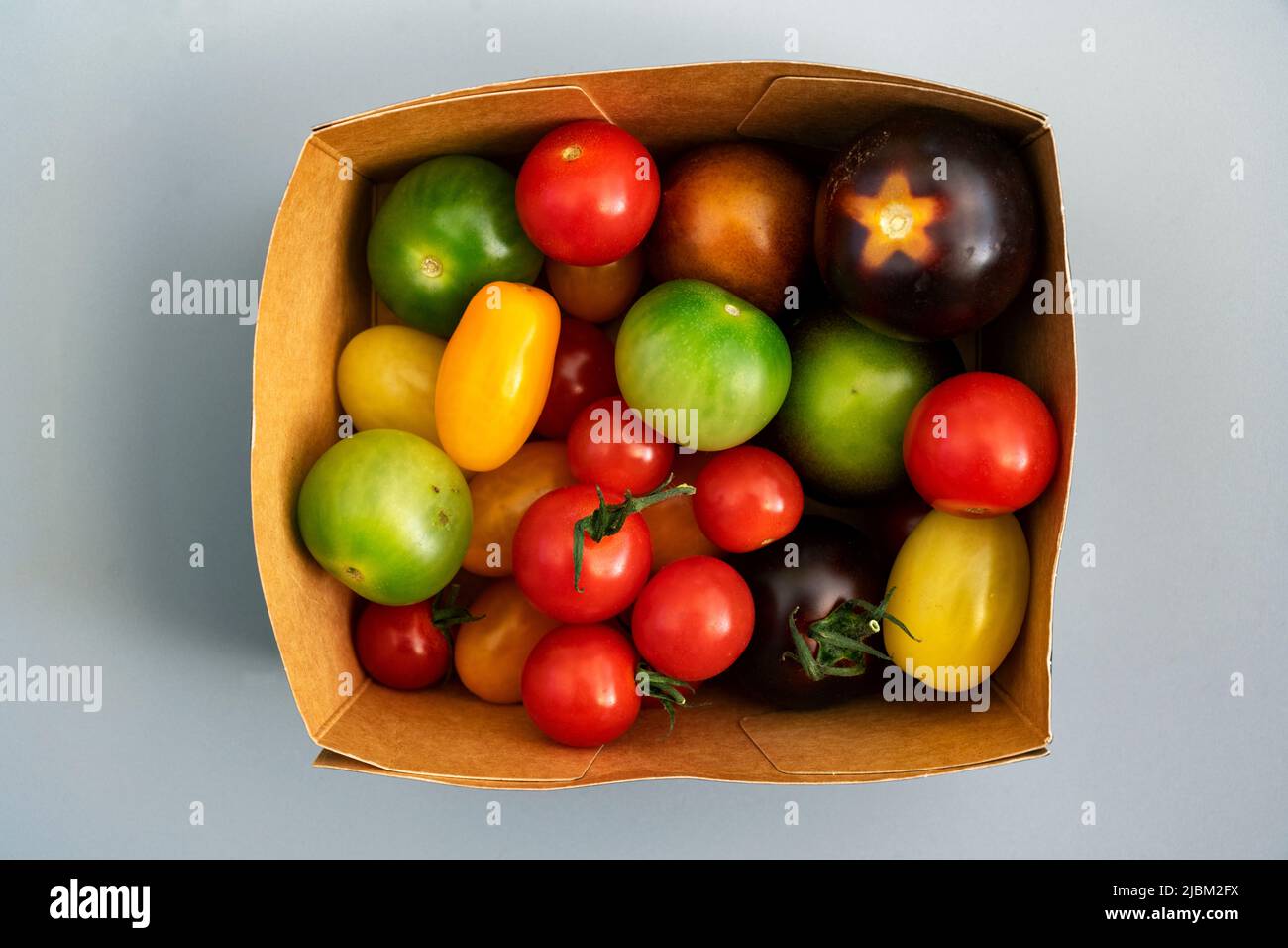 Coloured tomatoes Stock Photo