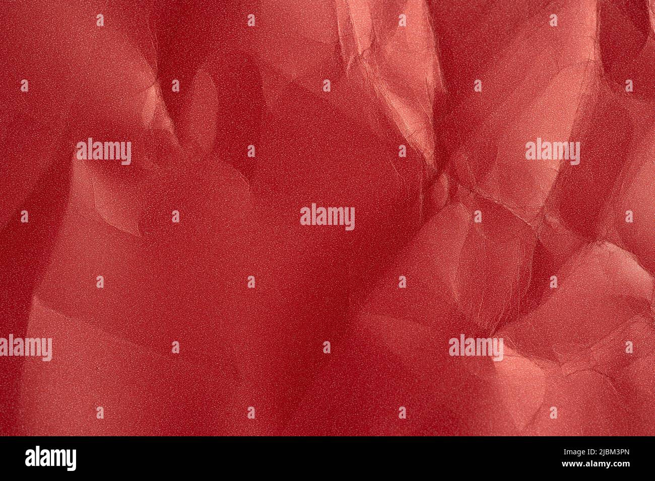 an empty wrinkled red pearl tissue paper textured background. text