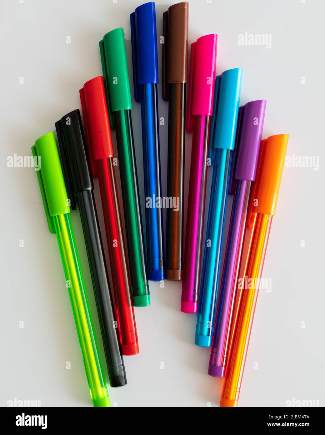 Colorful plastic ballpoint writing pens isolated on a white background. Stock Photo