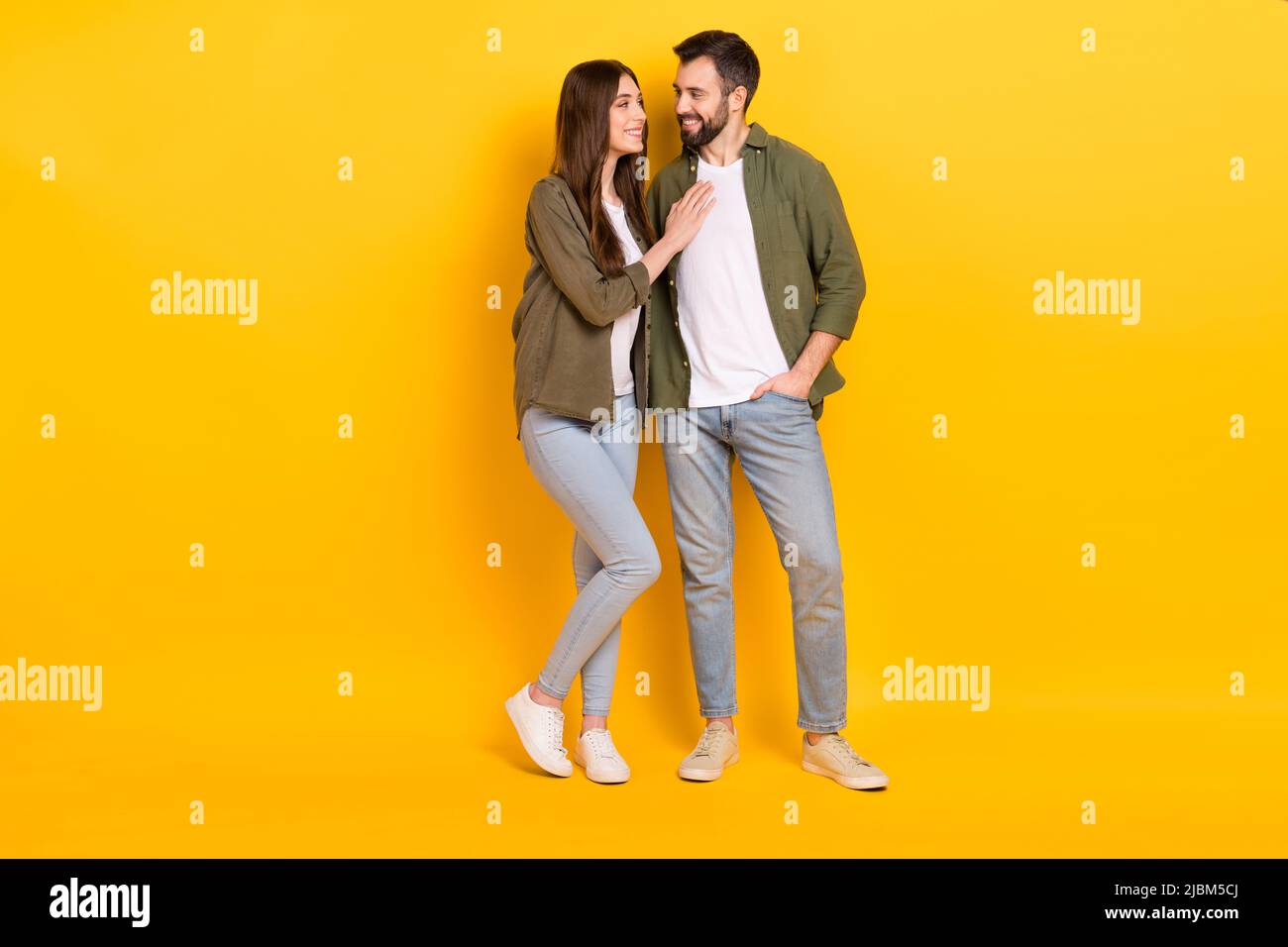 Full length photo of adorable couple wear matching clothes hug embrace ...