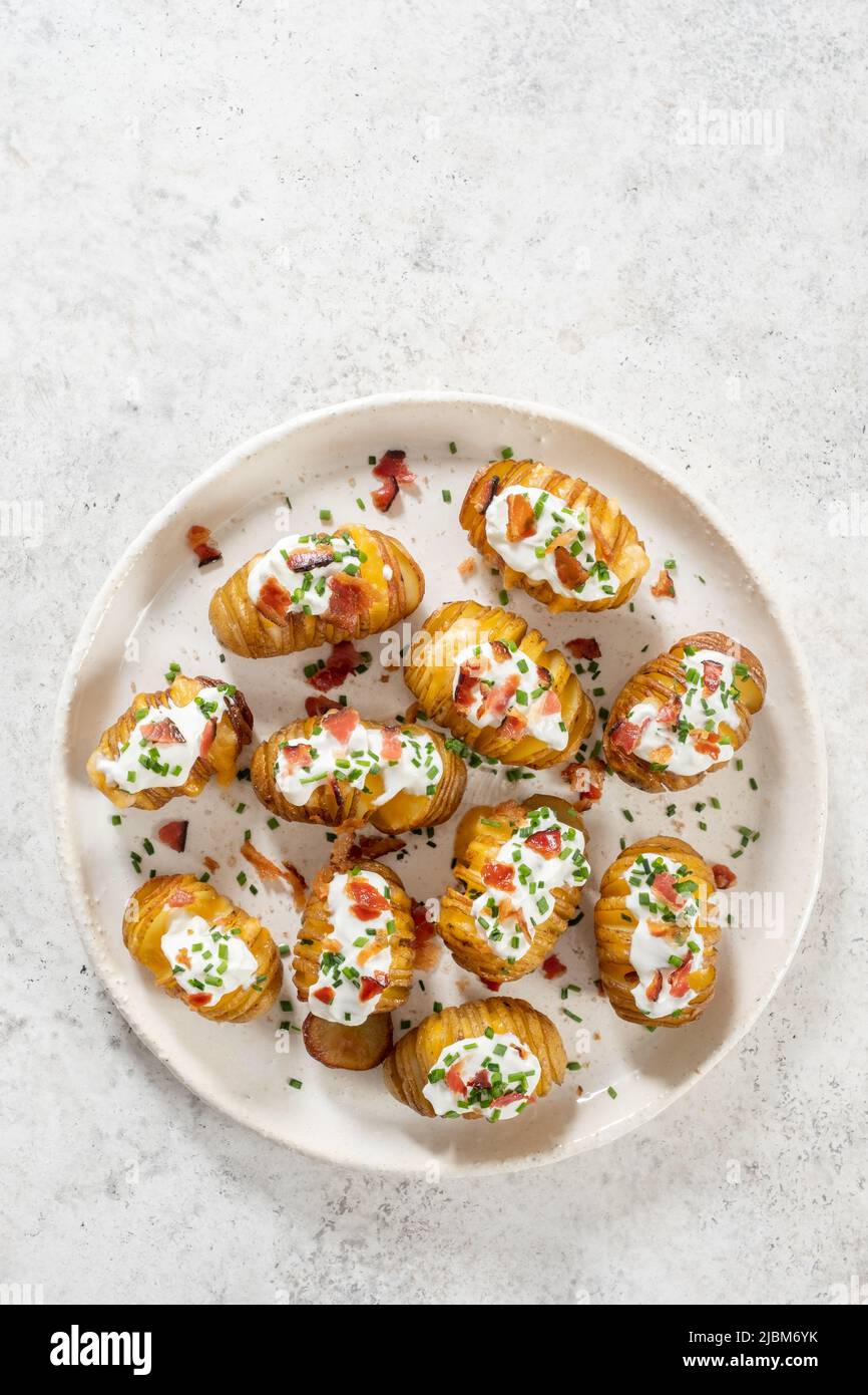 baked potato stuffed with cheese, bacon and sour cream Stock Photo Alamy