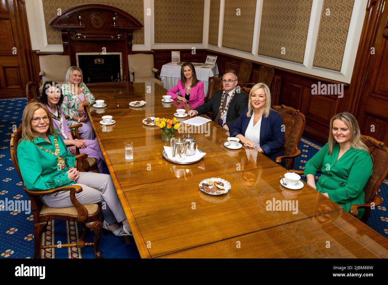 (Left-right) Lord Mayor of Belfast Sinn Fein Councillor Christina Black, Chair of Mid Ulster District Council Sinn Fein Councillor Cora Groogan, Mayor of Derry City and Strabane District Council, Sinn Fein Councillor Sandra Duffy, Vice-Chair of Newry, Mourne and Down District Council Sinn Fein Councillor Aoife Finnegan, Chairperson of Fermanagh & Omagh District Council Sinn Fein Councillor Barry McElduff, Sinn Fein Vice President Michelle O'Neill MLA, Vice-Chair of Causeway Coast and Glens Borough Council Sinn Fein Councillor Kathleen McGurk during an invitation to the Lord Mayor's Parlour at  Stock Photo