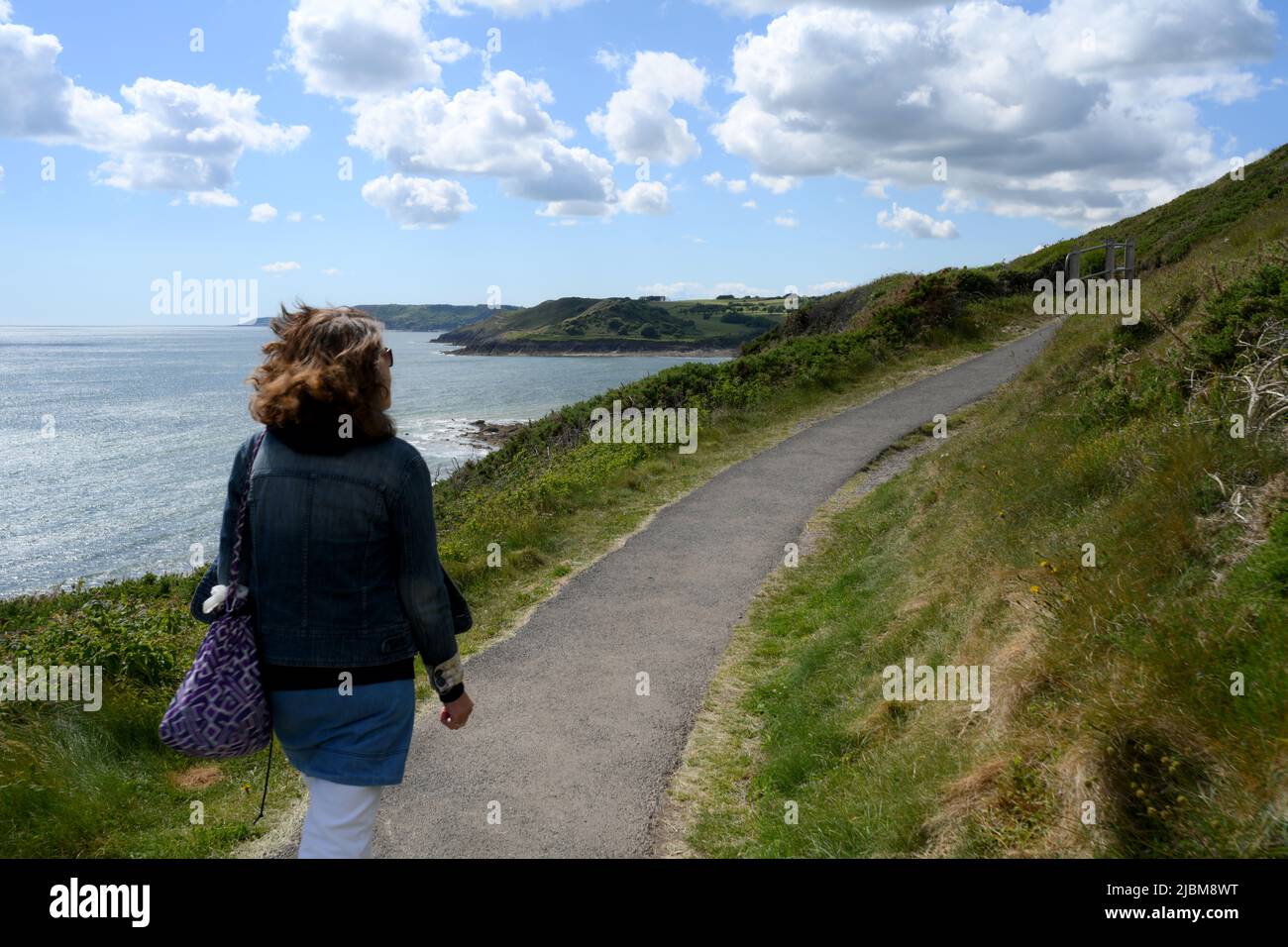 Walking on the footpath from Bracelet to Langland Bay, Gower, Swansea, Wales, UK Stock Photo