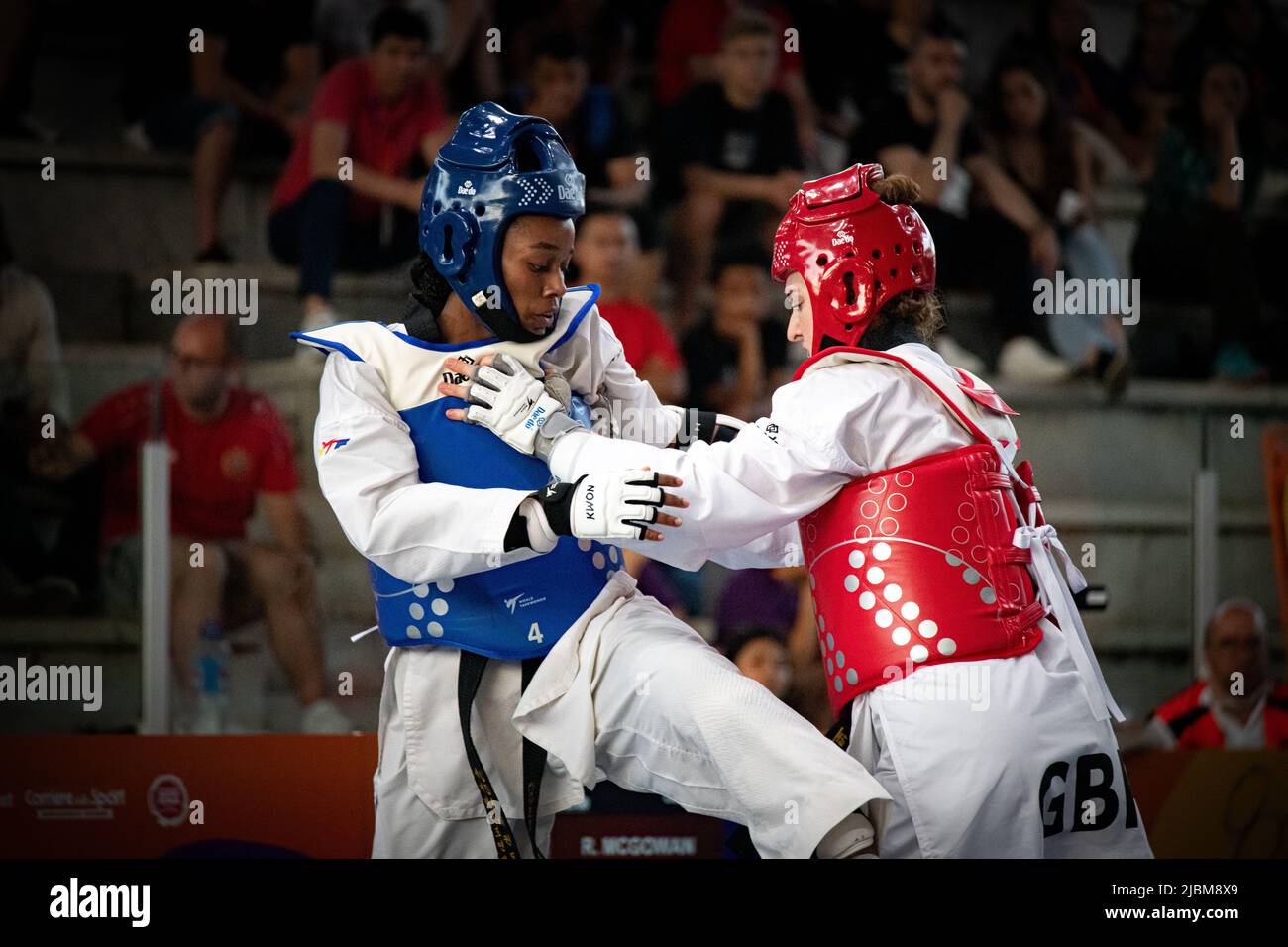 Female taekwondo fighter combat during match. World Taekwondo championship, Rome, Italy, june 4 2022 Stock Photo