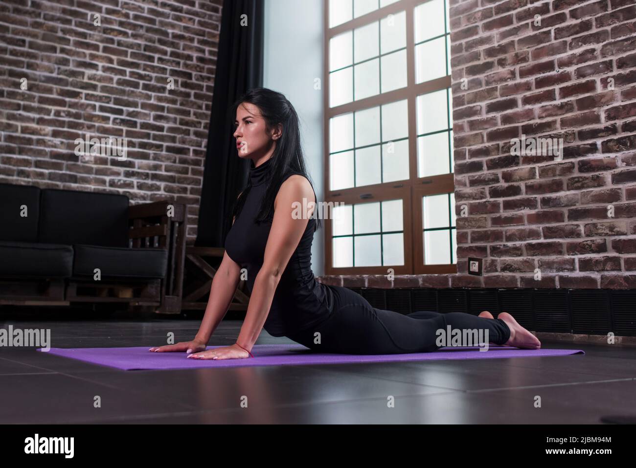 Girl doing bhujangasana cobra pose hi-res stock photography and images ...