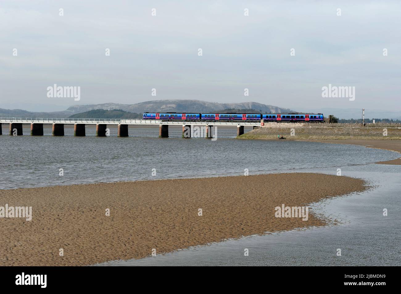 A First Rail train crossing the Kent Viaduct in the village of Arnside ...