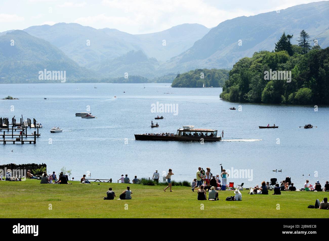 Tourists and pleasure boats on Derwent Water near Keswick in the Lake District Cumbria UK Stock Photo