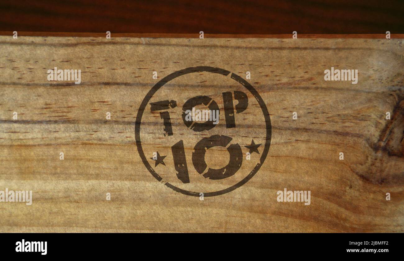 Top 10 stamp printed on wooden box. Bestseller and sale promotion rating symbol concept. Stock Photo